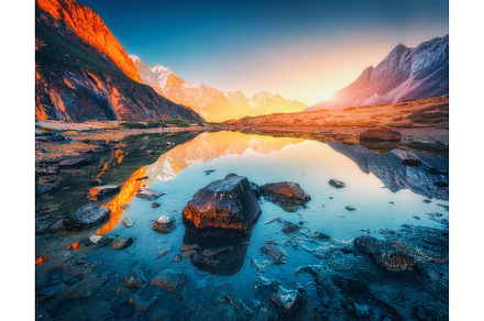 Illuminated Peaks Above a Mountain Lake